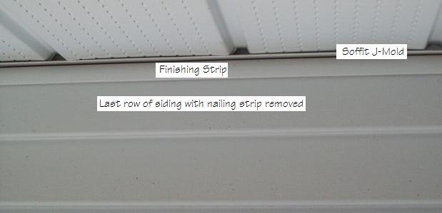 Photo of vinyl siding trim below the soffit.